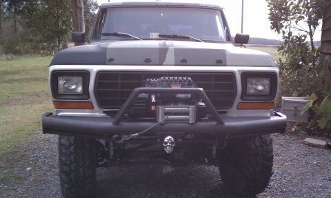 1979 Ford Bronco - This 1979 Ford Bronco features a winch and a skull hitch cover, ready for off-road adventures.