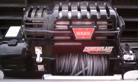 1979 Ford Bronco - A close-up view of a Warn PowerPlant Dual Force HD winch mounted on a vehicle.