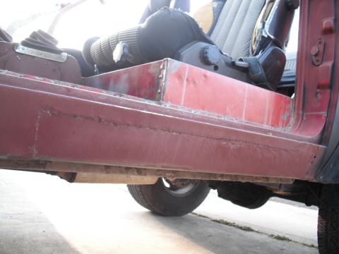 1968 Ford Bronco - Rust and body damage are visible on the interior door sill and floor pan of this 1968 Ford Bronco.