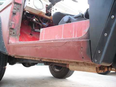 1968 Ford Bronco - This 1968 Ford Bronco shows significant rust on the rocker panel and exposed wiring in the interior.