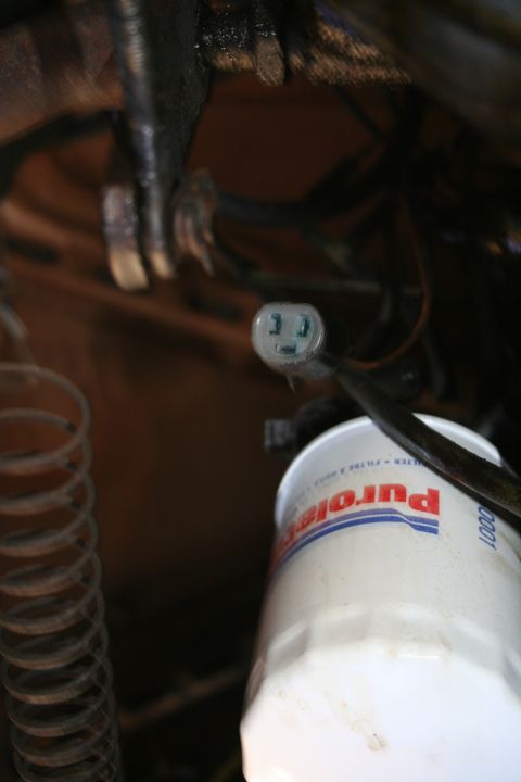 1982 Ford Bronco - Close-up of a Purolator oil filter and an electrical connector.
