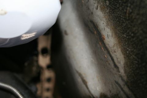 1982 Ford Bronco - Close-up view of an oil filter and surrounding engine bay components, suggesting a maintenance or repair context.