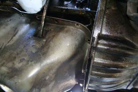 1982 Ford Bronco - Close-up view of the oil pan and transmission housing, with a Supermotors.net logo visible at the bottom right.