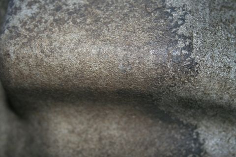 1982 Ford Bronco - A close-up view of a metal part, possibly from a vehicle's transmission, with visible text from a website watermark.
