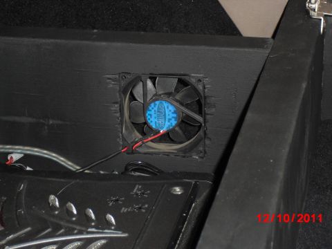 1996 Ford Bronco - A computer fan for cooling the amps; forgive the rough finish around the hole, but all I had to do it with at the time was a rotary cutting…