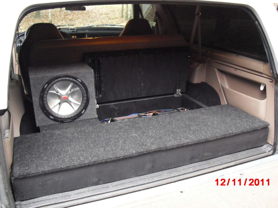 The compartment for the amps; there is another hinged storage compartment under the subwoofer