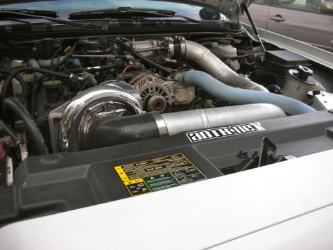 2004 Ford Crown Victoria - Custom turbocharger installation in an engine bay, ADTR.net branding.