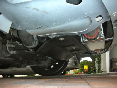 2004 Ford Crown Victoria - This photo shows the undercarriage of a vehicle, focusing on aftermarket modifications like an intercooler and piping.
