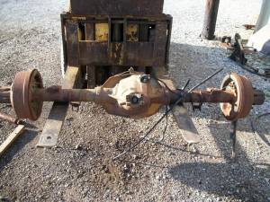 1995 Ford Bronco - Rear axle assembly from a Ford vehicle, likely a truck or SUV, shown with drum brakes.