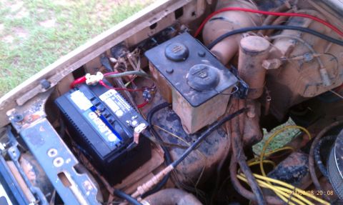 1987 Ford Bronco - The engine bay shows a battery and fluid reservoirs, but no clear year identification is visible.