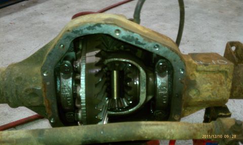 1987 Ford Bronco - Close-up of an open differential, showing internal gears and a "4.10" marking on the housing.