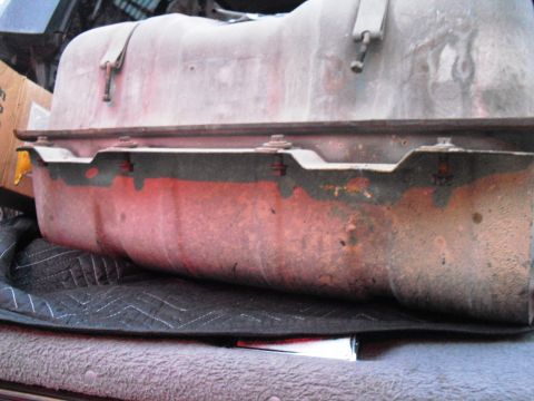 1986 Ford Bronco - This is a close-up of a vehicle's fuel tank, showing signs of rust and wear.
