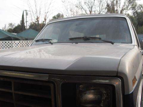 1986 Ford Bronco - Front view of a 1986 Ford Bronco, focusing on the hood and grille details.