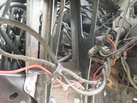 1986 Ford Bronco - Close-up view of the engine bay, showing complex wiring and custom metalwork.