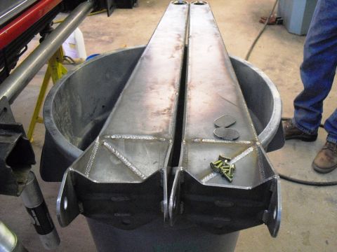 1986 Ford Bronco - These fabricated radius arms are ready for installation, shown here with a collection of hardware.