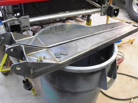 1986 Ford Bronco - Custom radius arms are shown resting on a trash can, ready for installation.