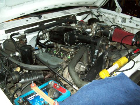 1993 Ford F-150 - Engine bay view showing a supercharger and air intake system.