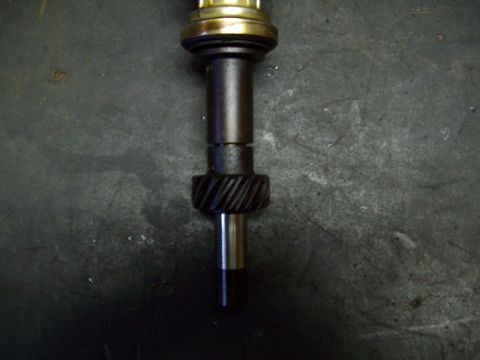 1993 Ford F-150 - A close-up view of a distributor gear, a component of an engine's ignition system.