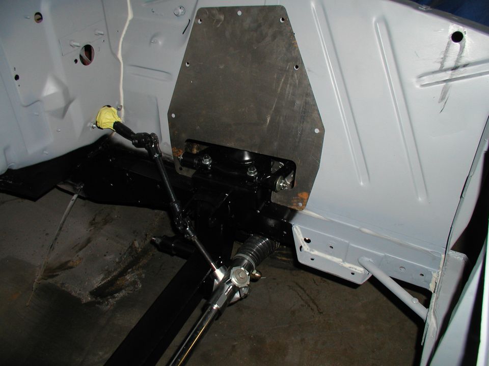 firewall area of a car with steering linkage installed