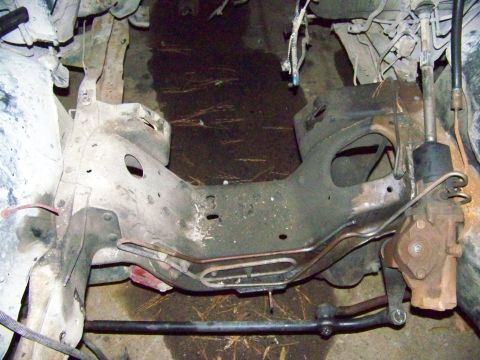 1985 Ford Bronco - Undercarriage view shows steering components and frame structure, with Supermotors.net watermark.