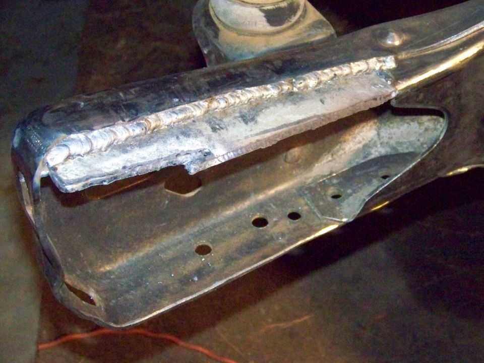 Welded metal frame part with Supermotors.net logo