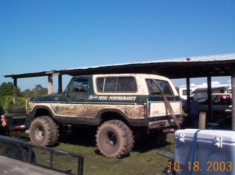 1995 Ford Bronco - This heavily modified 1978 Ford Bronco is covered in mud and sits on large off-road tires.