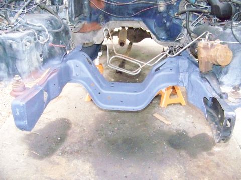 1985 Ford Bronco - Front frame section and engine bay components of a vehicle undergoing work.
