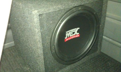 1992 Ford F-150 - My sub. The amp is under the middle front seat. *Update: Amps are now under the lifted rear seat.