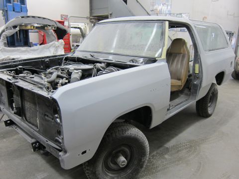 1987 Dodge 1500 - This Dodge Ramcharger is in a workshop, with its hood open and body primed for paint.