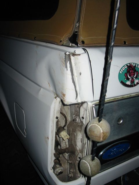 1992 Ford Bronco - backed into a tree and the force of the impact caused the antenna to crease the rear of the quarter panel and destroy the tail light.