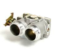 1990 Ford Bronco - A cast-aluminum twin-bore throttle body shown against a white background, with two large round throttle openings and a throttle linkage/lev…