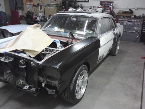 1966 Ford Mustang - This 1966 Ford Mustang is in a garage, clearly in the process of body work and restoration.