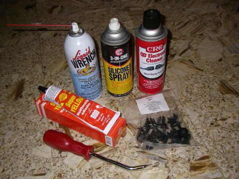 1990 Ford Bronco - Collection of automotive maintenance supplies including weatherstripping adhesive, silicone spray, electronic cleaner, and trim clips.