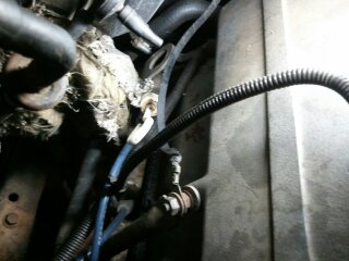 1989 Ford Bronco - Wiring harness in the engine bay shows signs of wear and tear.