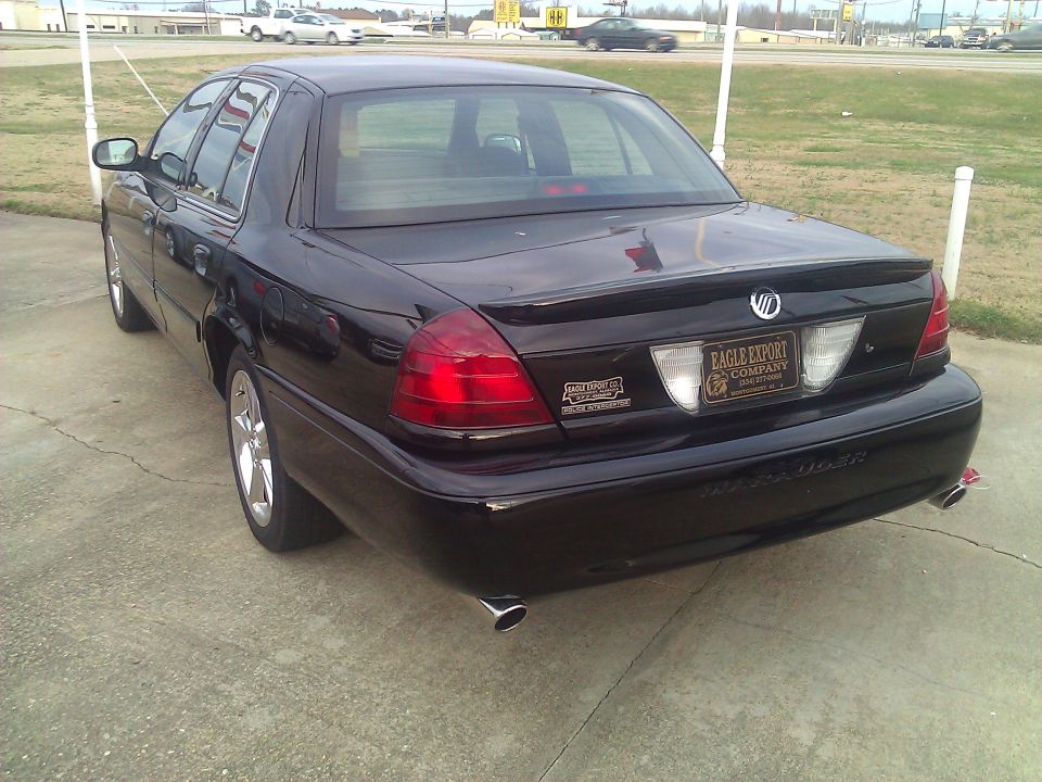 Rear three-quarter view of a black Mercury Marauder sedan with dual exhaust