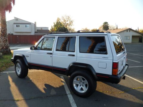 1994 Jeep Cherokee - This 1994 Jeep Cherokee is shown in a 3q-front view under a clear sky.