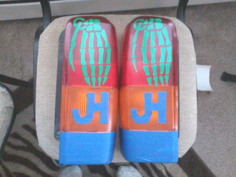 1998 Jeep Cherokee - These custom tail lights feature skeleton hand graphics and blue lettering.
