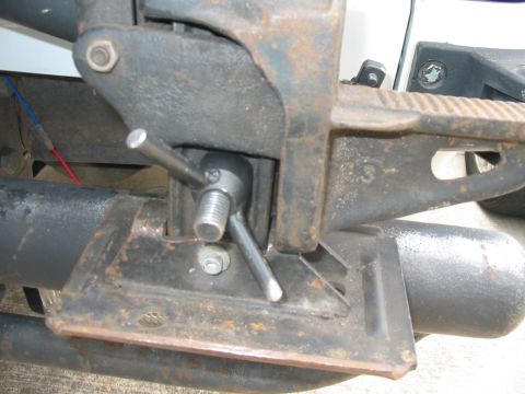 1992 Ford Bronco - A close-up view of the mechanical components of a vehicle's jack system.