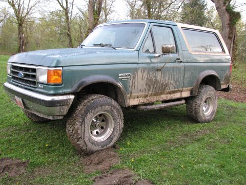1990 Ford Bronco - This Ford Bronco is covered in mud, suggesting it has been off-roading.