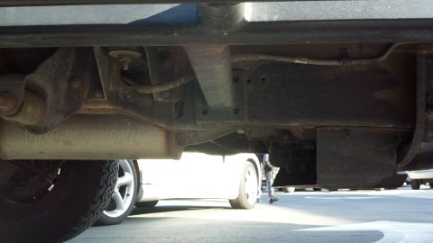 1996 Ford Bronco - Underbody view of a 1996 Ford Bronco, revealing the exhaust and suspension parts.