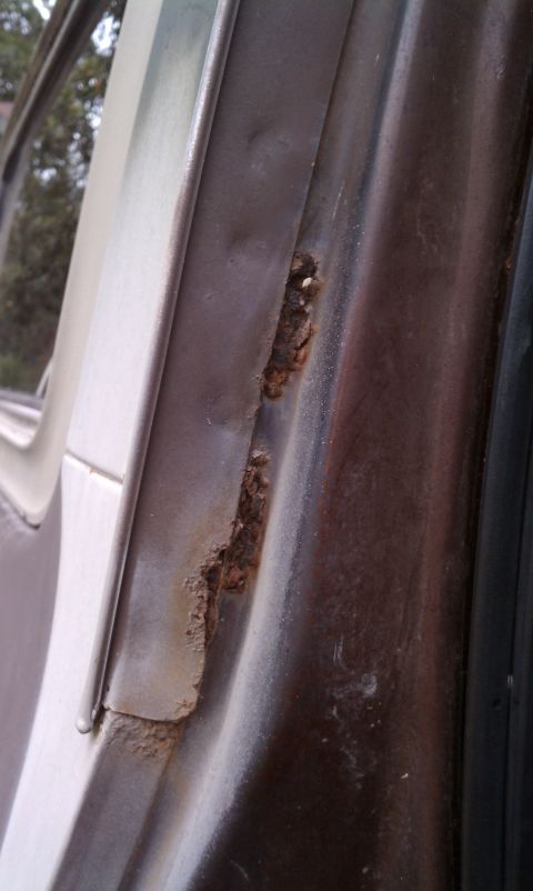 1979 Ford Bronco - Significant rust is visible on the door frame of this vehicle, suggesting potential structural issues.