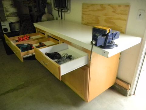 1997 Ford Ranger - Workbench with drawers open, revealing tools and a vise attached to the countertop.