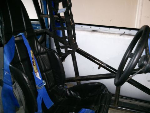1967 Ford Mustang - Interior view of a racing seat and roll cage, not a 1967 Ford Mustang.