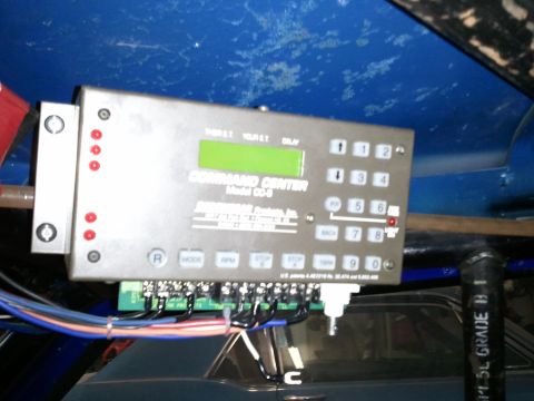 1967 Ford Mustang - A close-up view of the Command Center CD-8 control unit, likely an aftermarket addition to a vehicle's interior.