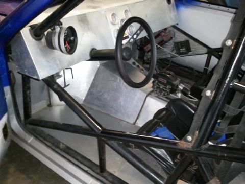 1967 Ford Mustang - Interior view of a custom-built race car, a roll cage and racing seat.