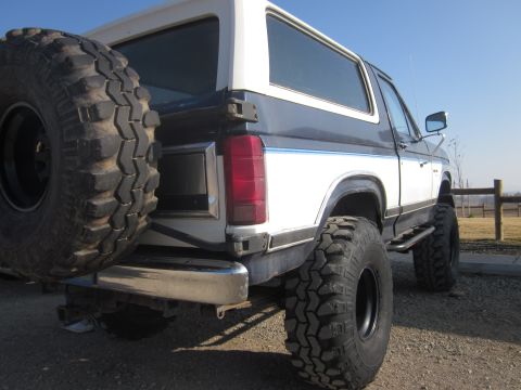 1985 Ford Bronco - This lifted 1985 Ford Bronco features large off-road tires and a two-tone paint scheme.
