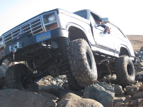 1985 Ford Bronco - This modified Ford Bronco navigates a rocky terrain, its off-road capabilities.