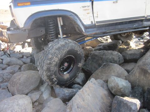 1985 Ford Bronco - Ford Bronco tackling a challenging rocky terrain, its off-road capabilities.