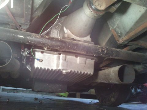 1967 Ford Mustang - This photo shows the underside of a vehicle, focusing on the transmission and exhaust system components.