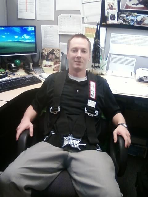 2000 Jeep TJ - Man wearing a racing harness in an office cubicle setting.